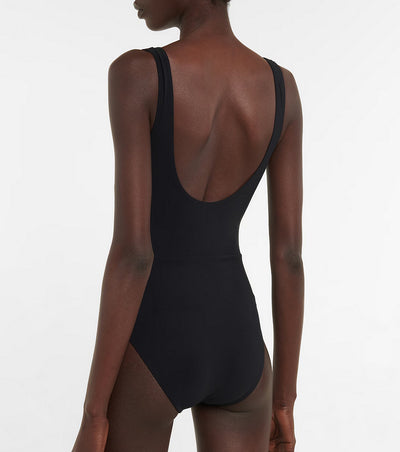 Black one-piece swimsuit with a deep V-neckline and white horizontal stitching detail across the plunge. - Image 14