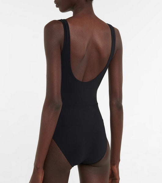 Black one-piece swimsuit with a deep V-neckline and white horizontal stitching detail across the plunge. - Image 14