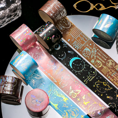 Retro laser washi tape with holographic postal stamps, airmail markings, and travel-themed text on a brown background.