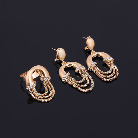 Four-piece gold-tone bridal jewelry set with crystal accents, including a statement necklace, dangling earrings, bracelet, and ring. - Image 8