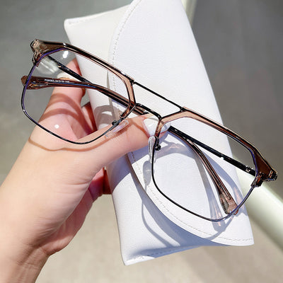 Anti-blue light glasses with a sand black and silver double beam frame, held against a white case. - Image 4