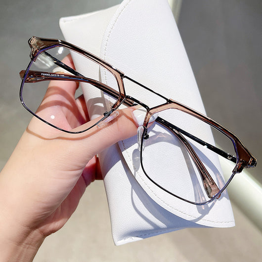 Anti-blue light glasses with a sand black and silver double beam frame, held against a white case. - Image 4