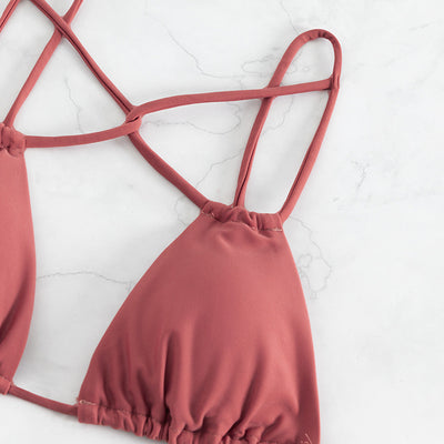 Red bean paste women's bikini swimwear with a triangle top and high-cut double-strap bottoms, laid flat. - Image 6