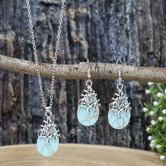 Vintage-style silver-tone necklace and dangle earrings set with oval frames and marbled blue and yellow stones. - Image 10