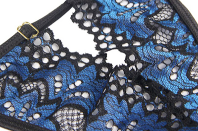 Plus size model in a black and blue lace push-up teddy with garter straps and fishnet stockings. - Image 13