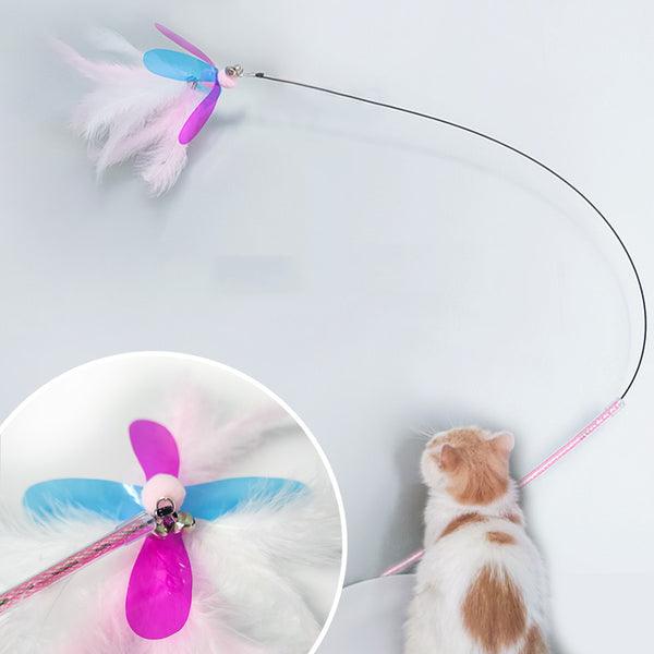 Fluffy pink feather cat toy replacement head with iridescent purple and blue wings, small bells, and a hook.