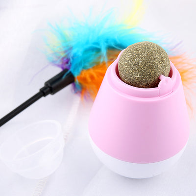 Pink and white tumbler cat toy with a clear dome revealing a catnip ball and a colorful feather wand. - Image 6