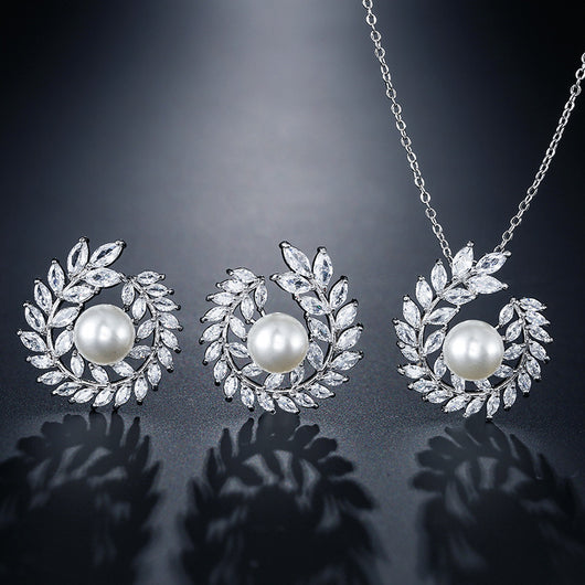 Elegant pearl and cubic zirconia jewelry set with a necklace and two earrings, featuring a wreath design. - Image 10