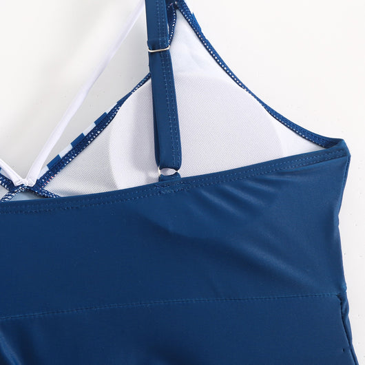 Plus size women's navy blue tankini swimsuit with white striped V-neck top and matching flared handkerchief hem. - Image 14