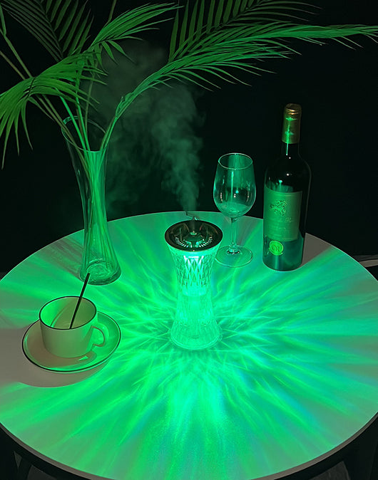 Rose gold and clear crystal-like desktop humidifier with a faceted body and an atmosphere lamp function. - Image 5