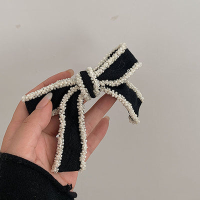 Diadema Elegante con Moño Blanco y Detalles Perlados - Image 10