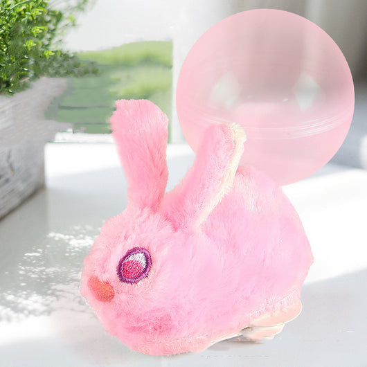 Beige plush simulated hamster cat toy with pink ears and a small tail, next to a translucent pink rolling ball. - Image 12