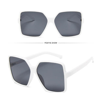 Oversized square sunglasses with a black and tortoiseshell frame and gradient purple lenses, shown from two angles. - Image 8