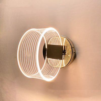 Modern simple LED wall lamp with a curved clear acrylic shade and a metallic base, emitting a warm light. - Image 3