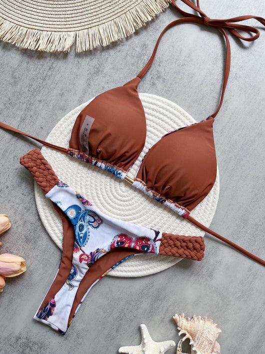 Women's blue, white, and gold marble print bikini with a triangle halter top and braided rope side details. - Image 13