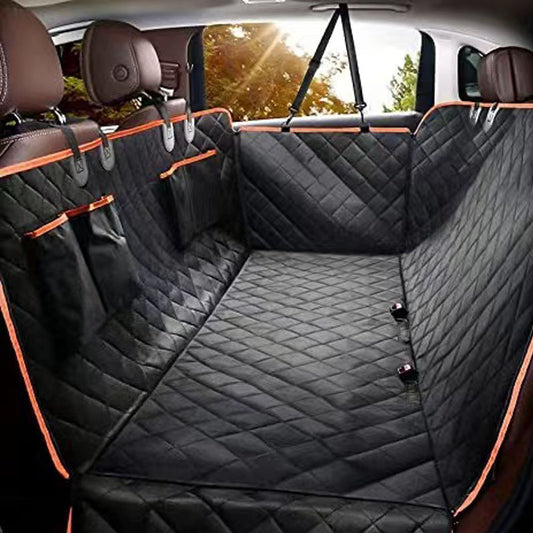 Black quilted Oxford cloth car pet mat installed in a car's rear seat, featuring a hammock design with side flaps.