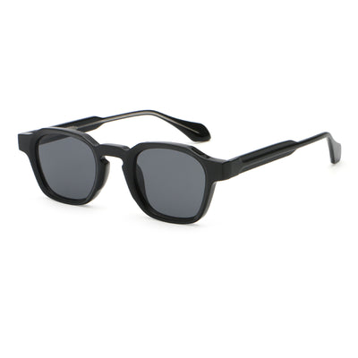 Classic fashion sunglasses with a black and tortoiseshell quadrilateral frame and dark green lenses, angled view. - Image 3