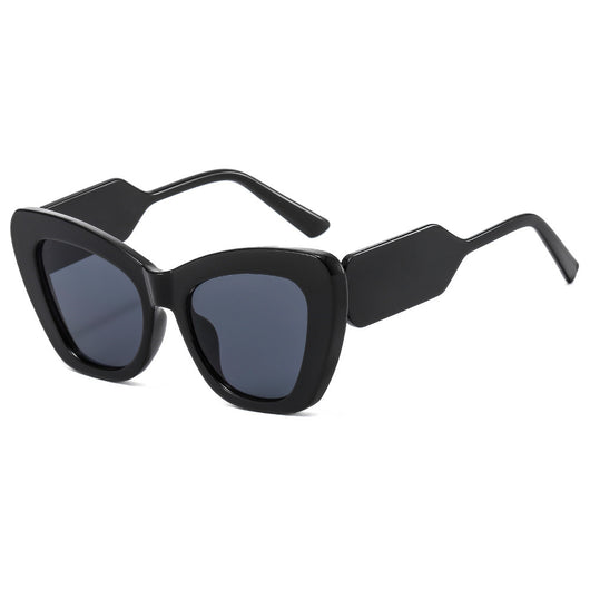 Pink cat-eye sunglasses with green temples and brown to pink gradient lenses on a white background. - Image 17