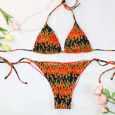 Flame print bikini swimsuit with a bandeau triangle top and tie-side split bottom in red, orange, yellow, and black. - Image 6