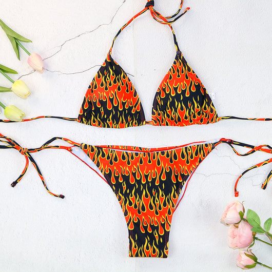 Flame print bikini swimsuit with a bandeau triangle top and tie-side split bottom in red, orange, yellow, and black. - Image 6