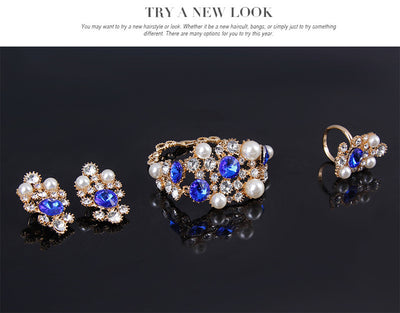 Four-piece bridal jewelry set with gold-toned necklace, earrings, bracelet, and ring, featuring amber and clear rhinestones with faux pearls. - Image 12