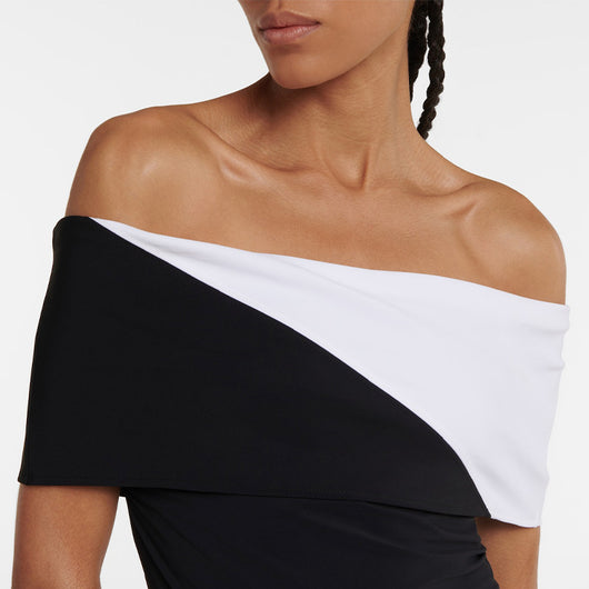 Black one-piece swimsuit with a deep V-neckline and white horizontal stitching detail across the plunge. - Image 31