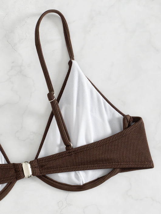 Black ribbed two-piece bikini with an underwire top and tie-side bottoms on a white marble surface. - Image 20