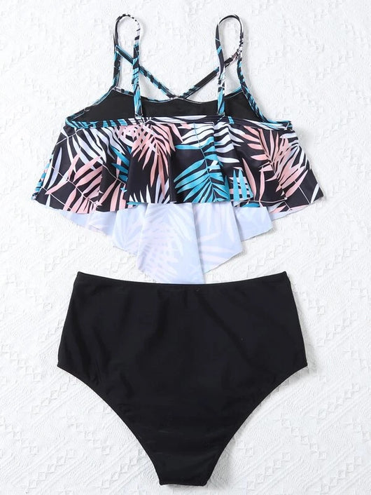 Women's split swimsuit with a black high-waisted bikini bottom and a flounced tankini top featuring a green, blue, and white tropical leaf print. - Image 23