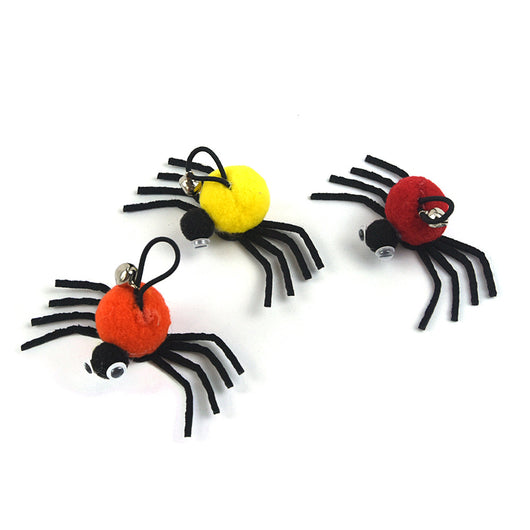 Orange and black plush spider cat toy with googly eyes and a silver bell on a white background. - Image 9