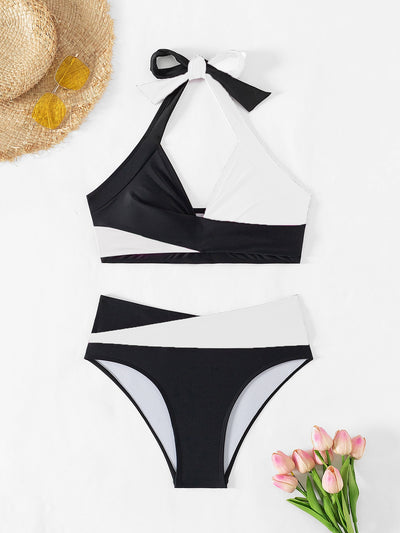 Black and white color-block halter bikini with high-waisted bottoms, modeled by a woman holding a straw hat. - Image 19