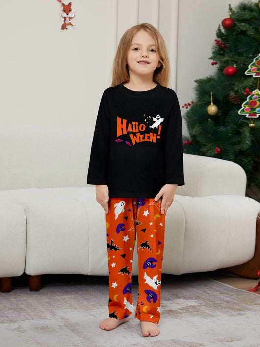 Family of four wearing matching black and orange Halloween long-sleeve pajamas with ghost and bat prints. - Image 14