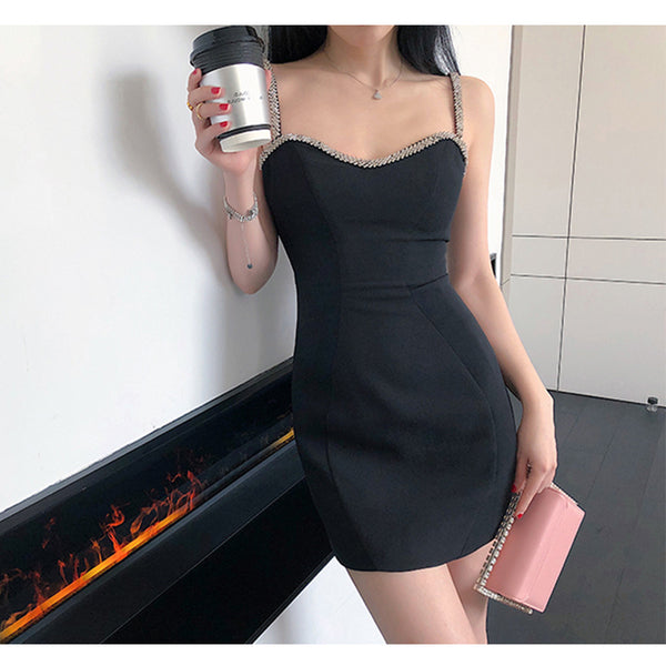 Falda Corta de Cadera con Strass Negro y Bolsa Integrada