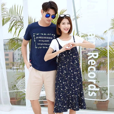 Navy blue short-sleeve t-shirt with a white floral-framed text print paired with light beige elastic-waist shorts. - Image 14