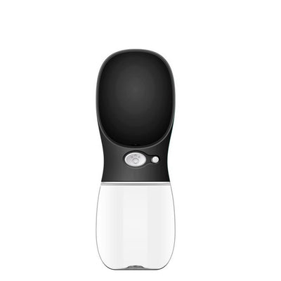 White portable pet water bottle with a clear reservoir and built-in drinking bowl, shown in a bag. - Image 17