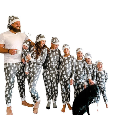 Family of seven and a dog in matching grey Christmas tree print pajamas with white cuffs and beanies. - Image 5