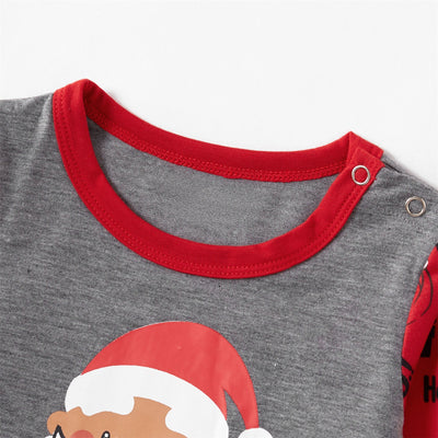 Children's grey and red long-sleeve pajama set with Santa Claus graphic on top and repeating Santa pattern on pants. - Image 3