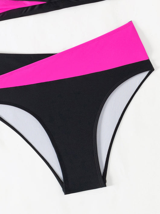 Black and white color-block halter bikini with high-waisted bottoms, modeled by a woman holding a straw hat. - Image 17