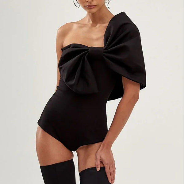 Black one-piece swimsuit with a white oversized bow detail at the tube top bust, perfect for summer.