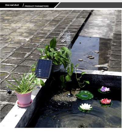 5W solar fountain kit with black solar panel on a ground stake, water pump, coiled hose, and various nozzles. - Image 19
