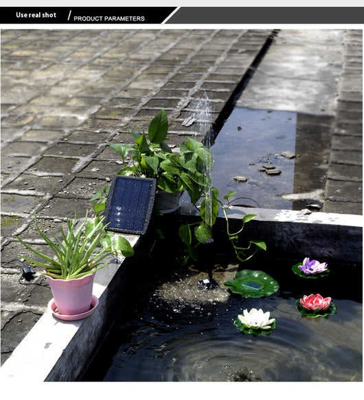 5W solar fountain kit with black solar panel on a ground stake, water pump, coiled hose, and various nozzles. - Image 19