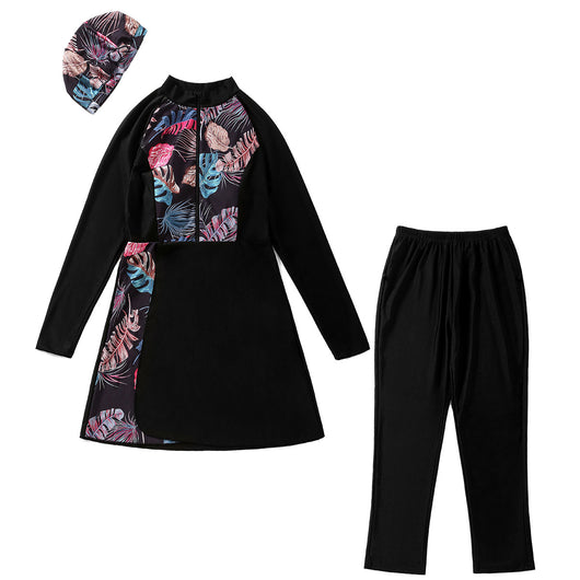 Woman in a navy blue quick-drying conservative swimwear set with a tropical leaf print tunic and matching swim cap. - Image 21