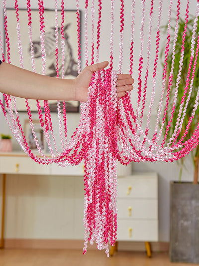 Brown and beige striped string curtain with twisted tassel texture, held by a hand, for living room partition. - Image 7
