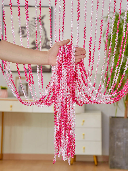 Brown and beige striped string curtain with twisted tassel texture, held by a hand, for living room partition. - Image 7