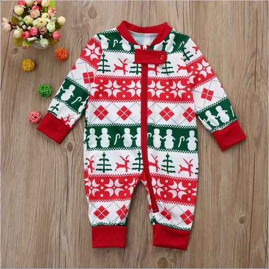 Christmas long-sleeved pajama set with red, green, and white fair isle print featuring snowmen, reindeer, and trees.