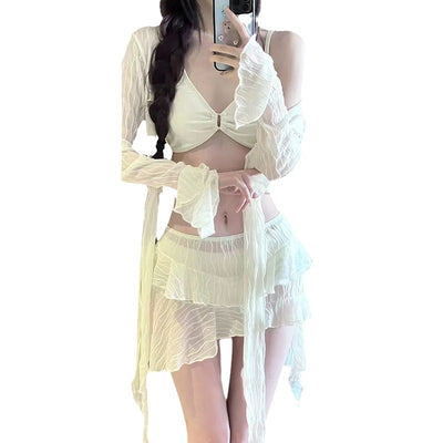 White four-piece bikini swimsuit set for women, featuring a long-sleeve tie-front top and tiered ruffle skirt. - Image 3
