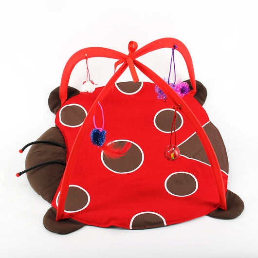 Giraffe print cat playing bed with a plush mat, an overhead arch, and hanging crocheted bird, spotted ball, and mouse toys. - Image 6