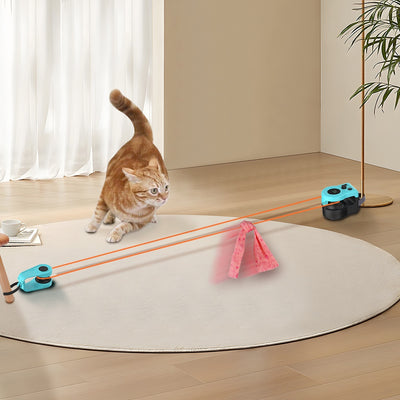 Blue and black cat weight loss remote control sound toy with string and feather, shown with a tabby cat playing. - Image 10