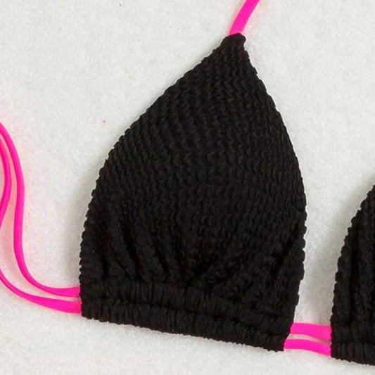 Black textured two-piece bikini with hot pink lace-up ties. Features a halter triangle top and high-cut bottoms. - Image 2