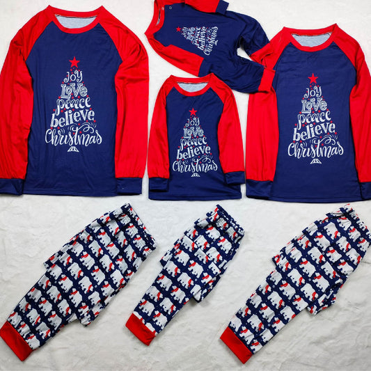 Family matching Christmas pajamas with blue long-sleeve tops, red raglan sleeves, and a Christmas tree graphic. Blue pants feature a white polar bear pattern.