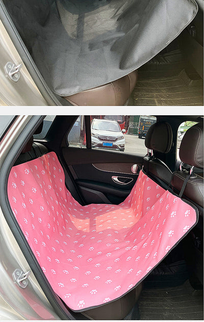 Pink car pet mat with white paw print and bone patterns, featuring black straps for securing to a rear seat. - Image 31